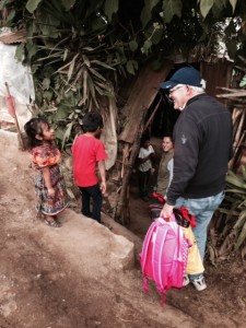 Dr. Norling's brother, John, being welcomed into his sponsor child's home